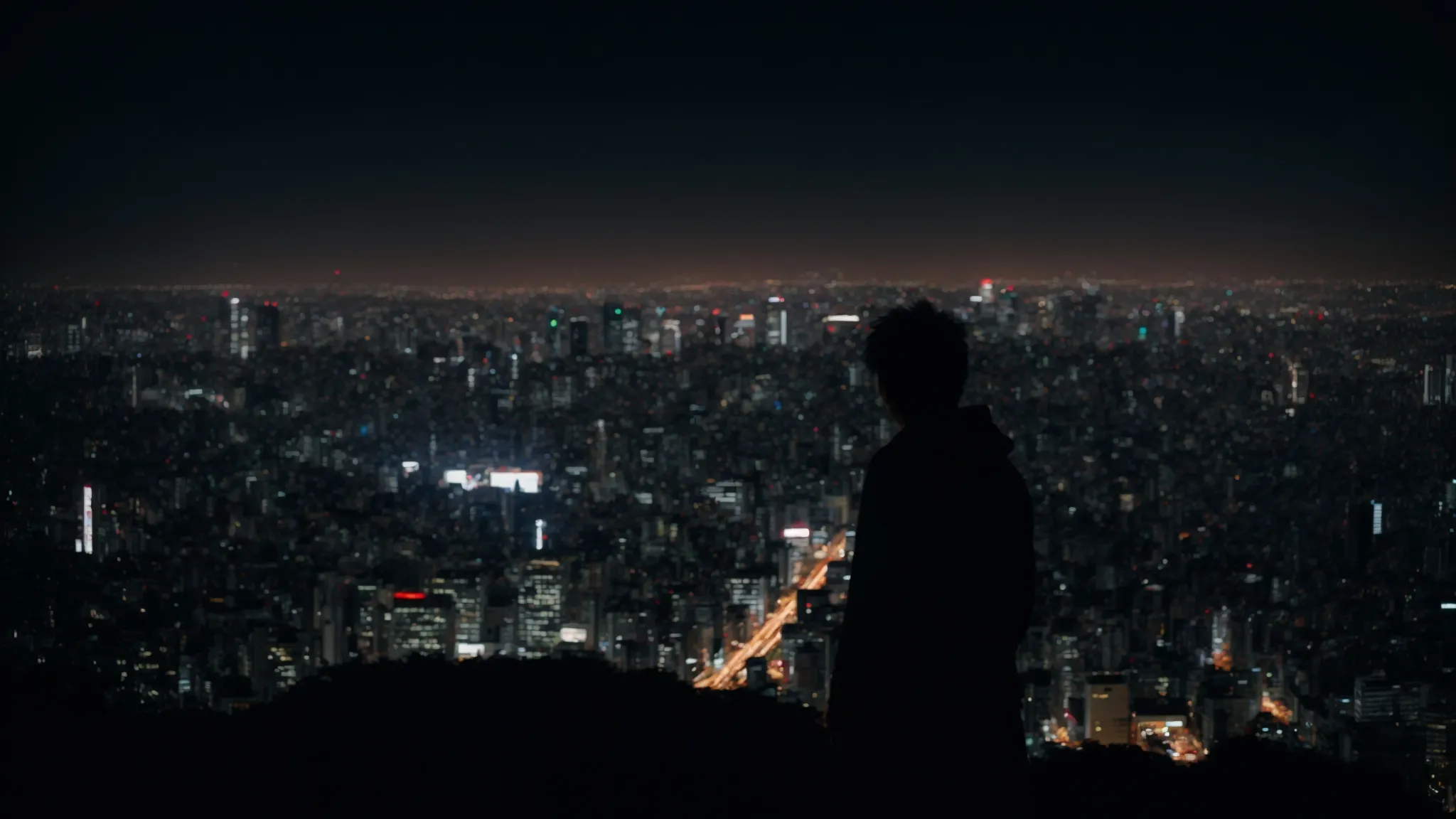 a shadowy figure glimpses over tokyo's skyline at night, reflecting the anime's global controversy.